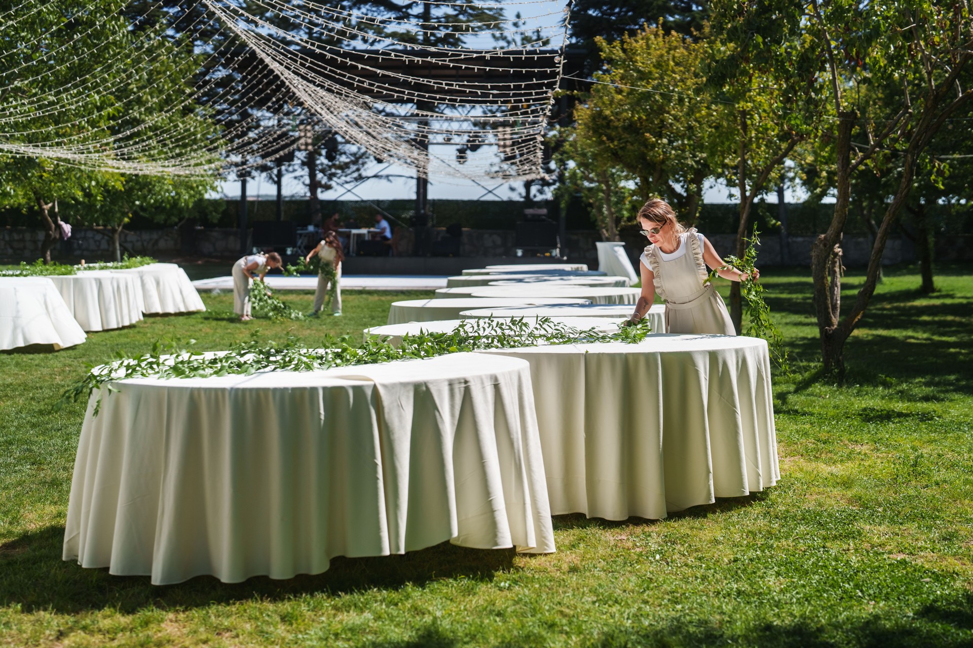 The wedding planning team is preparing the floral garlands